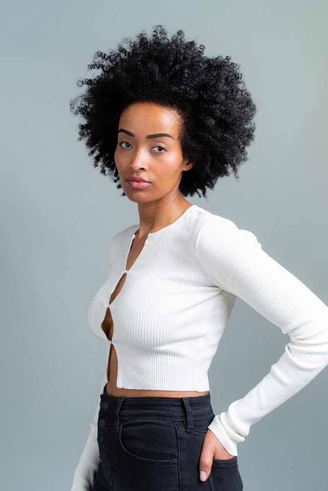 Portrait of Mimi, Canadian fashion model, in a cream tailored blazer